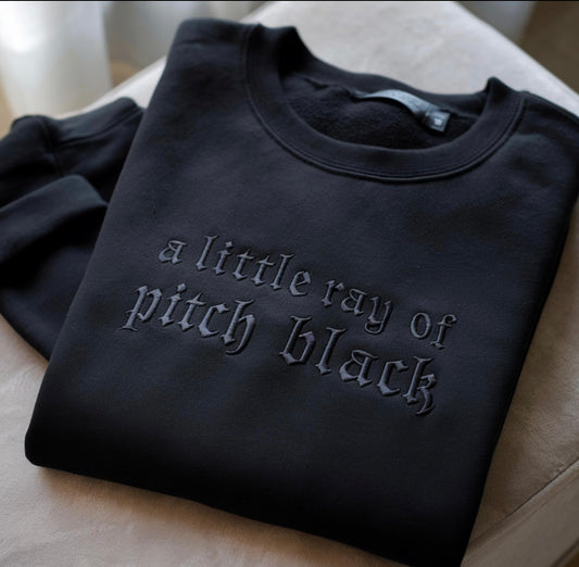 A little ray of pitch black embroidered crew
